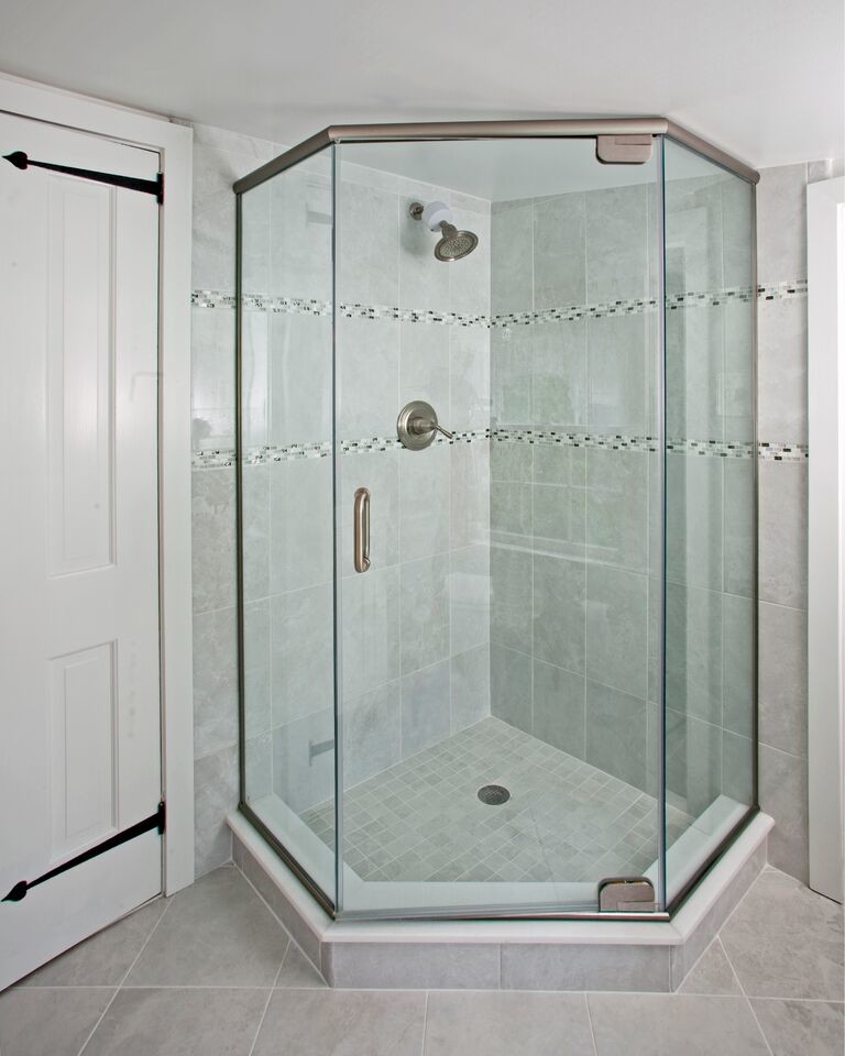 Design ideas for a medium sized contemporary shower room bathroom in Philadelphia with a corner shower, white walls, recessed-panel cabinets, white cabinets, a one-piece toilet, grey tiles, ceramic tiles, ceramic flooring, an integrated sink, solid surface worktops, grey floors and a hinged door.