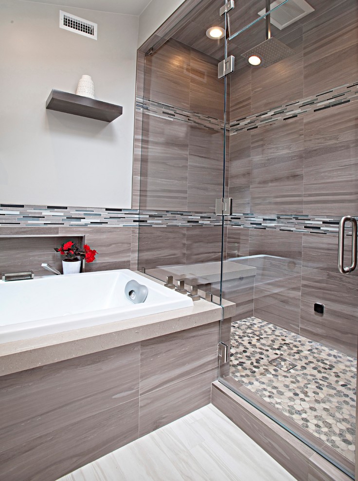 Mid-sized trendy 3/4 beige tile, brown tile, gray tile and matchstick tile porcelain tile bathroom photo in Orange County with flat-panel cabinets, dark wood cabinets, a two-piece toilet, beige walls, an undermount sink and quartz countertops
