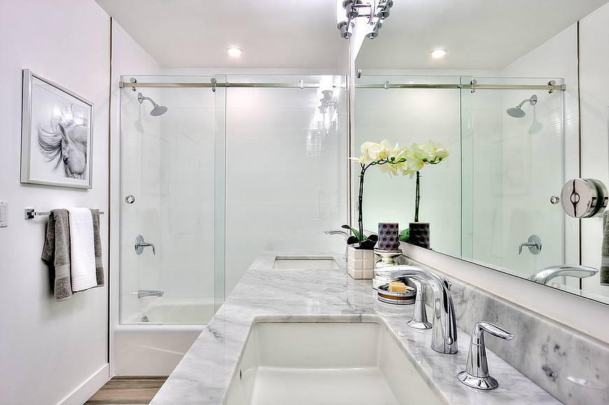 Inspiration for a medium sized classic shower room bathroom in Los Angeles with shaker cabinets, white cabinets, white walls, porcelain flooring, a submerged sink, marble worktops, an alcove bath, a shower/bath combination, grey floors and a sliding door.