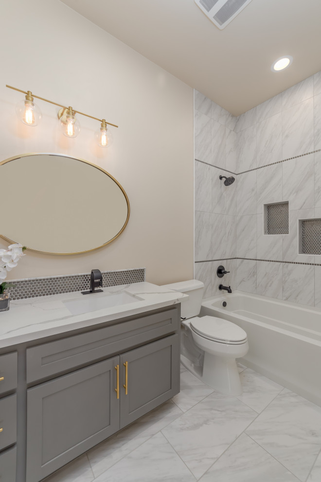 This is an example of a medium sized traditional shower room bathroom in Sacramento with shaker cabinets, grey cabinets, a shower/bath combination, ceramic flooring, a submerged sink, quartz worktops, a shower curtain, white worktops, a shower bench, double sinks and a built in vanity unit.