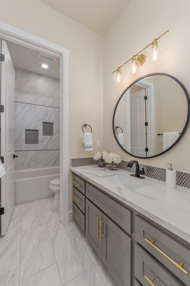 Design ideas for a medium sized classic shower room bathroom in Sacramento with shaker cabinets, grey cabinets, ceramic flooring, a submerged sink, quartz worktops, white worktops, a shower bench, double sinks, a built in vanity unit, a shower/bath combination and a shower curtain.