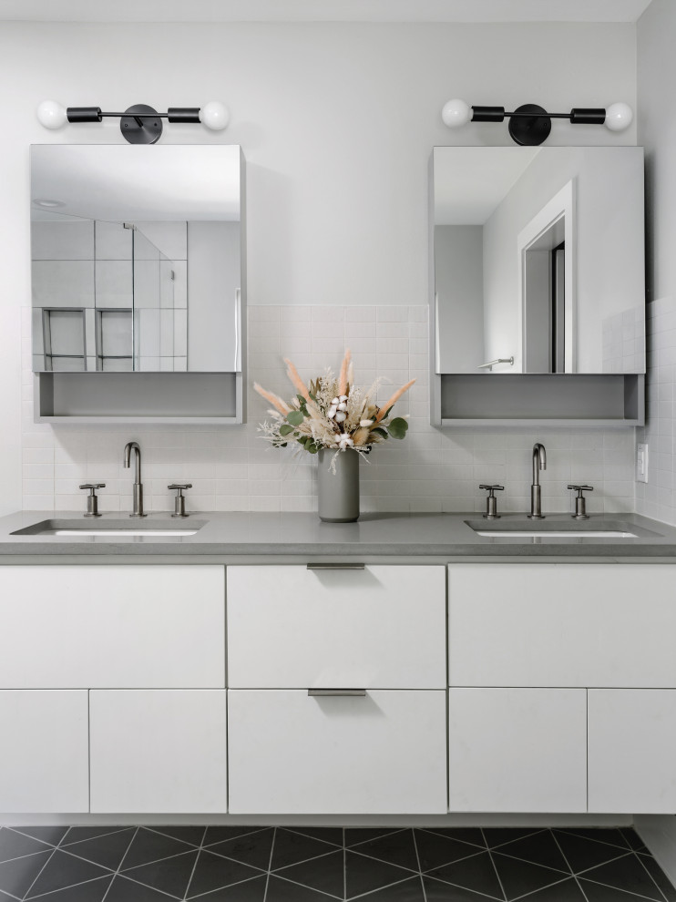 Medium sized scandi ensuite bathroom in Austin with flat-panel cabinets, white cabinets, a freestanding bath, grey tiles, porcelain tiles, grey walls, porcelain flooring, a built-in sink, engineered stone worktops, grey floors, grey worktops, double sinks and a floating vanity unit.