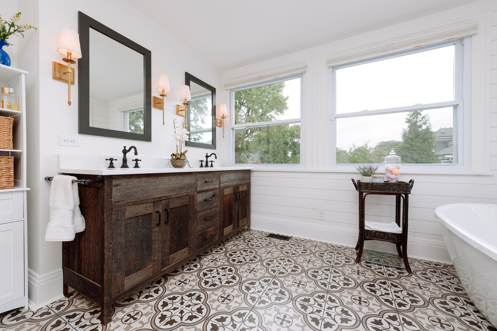 Inspiration for a mid-sized country master ceramic tile and black floor bathroom remodel in Cincinnati with flat-panel cabinets, dark wood cabinets, a two-piece toilet, white walls, an undermount sink, quartz countertops, a hinged shower door and white countertops