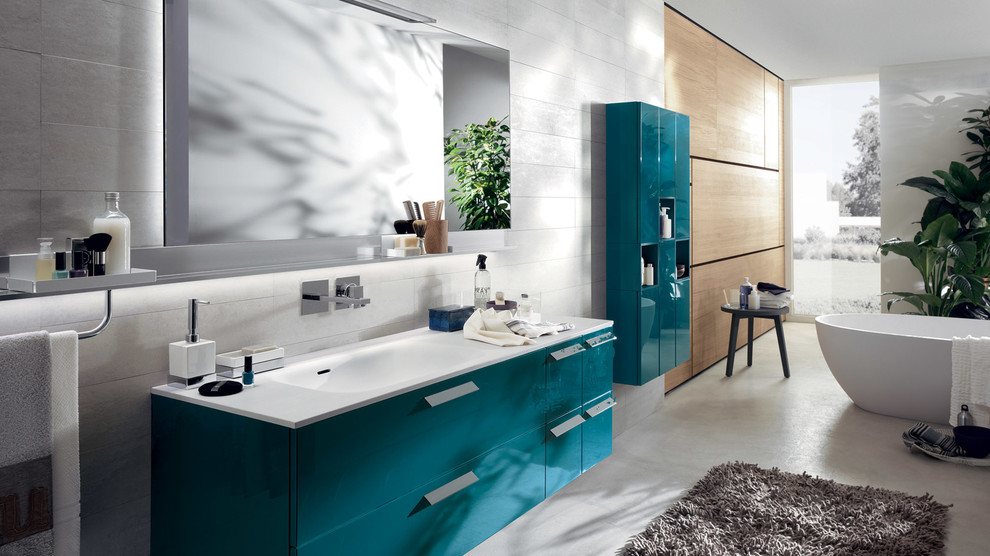 Bathroom - large contemporary master white tile and ceramic tile ceramic tile bathroom idea in Melbourne with an integrated sink, raised-panel cabinets, blue cabinets, solid surface countertops, a one-piece toilet and white walls