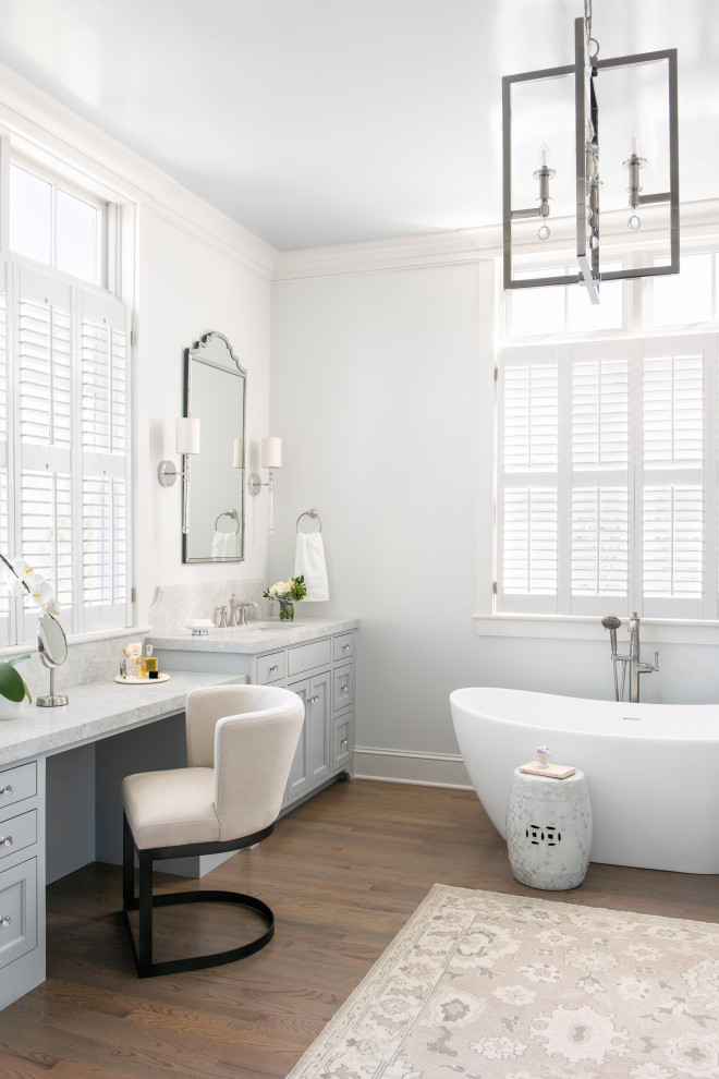 Bathroom - large transitional master double-sink and brown floor bathroom idea in Charleston with flat-panel cabinets, gray cabinets, an undermount sink, marble countertops, a built-in vanity, white walls and gray countertops