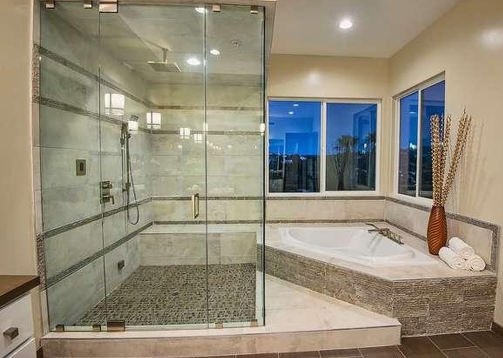 Inspiration for a huge contemporary master multicolored tile and stone tile ceramic tile tub/shower combo remodel in Los Angeles with raised-panel cabinets, light wood cabinets, a hot tub, a wall-mount toilet, beige walls, an undermount sink and quartz countertops