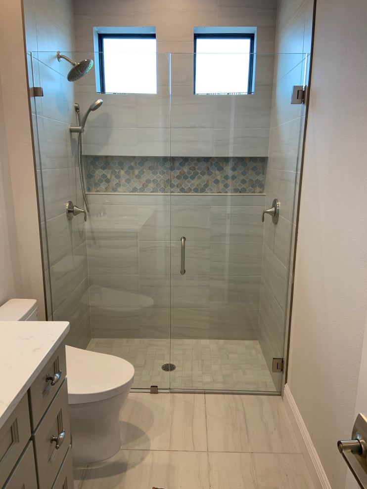 Inspiration for a small modern bathroom in Other with glass-front cabinets and a walk-in shower.