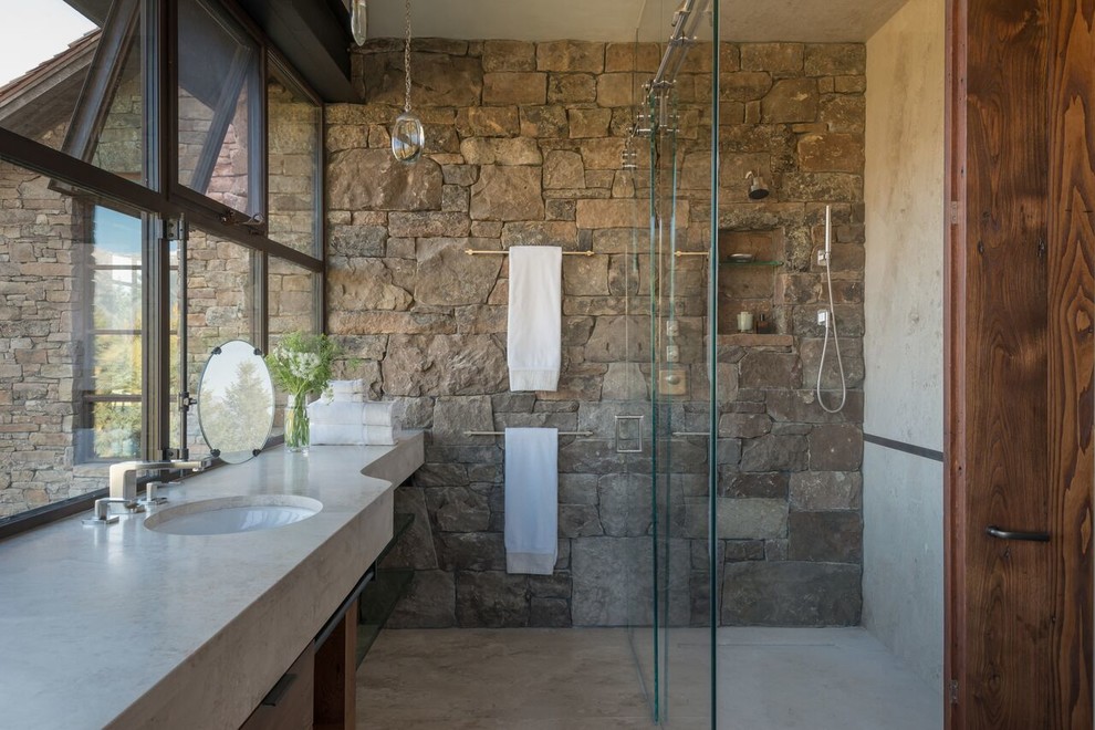 На фото: ванная комната в стиле рустика с душем без бортиков, врезной раковиной, серым полом, душем с раздвижными дверями и серой столешницей