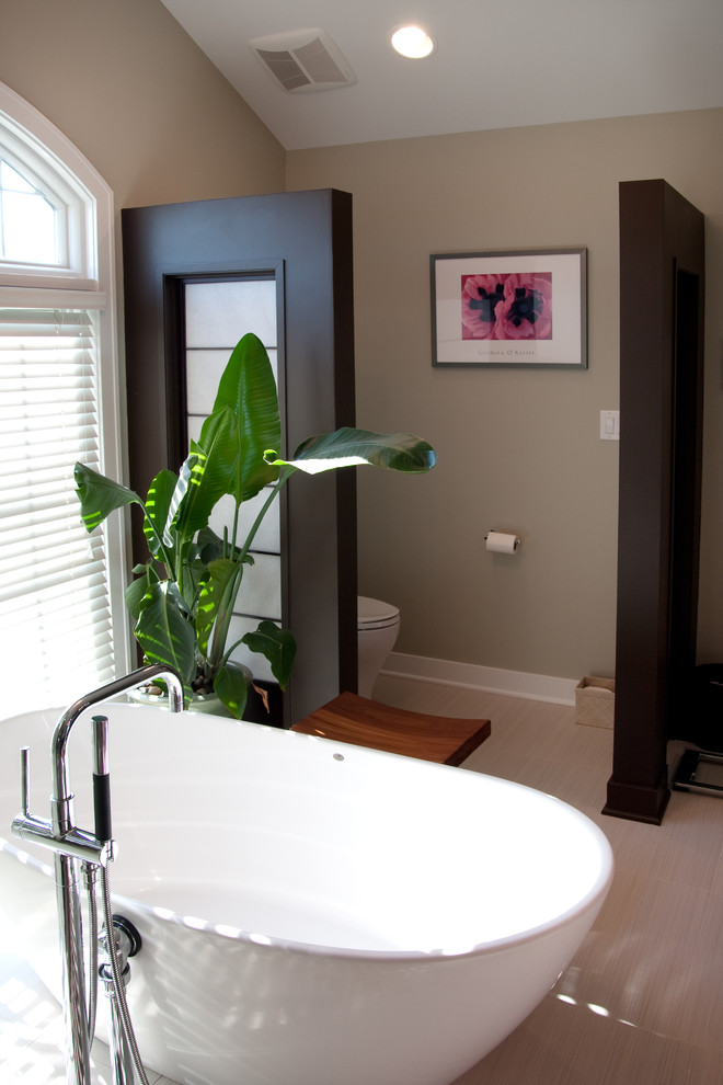 Large contemporary ensuite bathroom in Chicago with a freestanding bath, a two-piece toilet and brown walls.