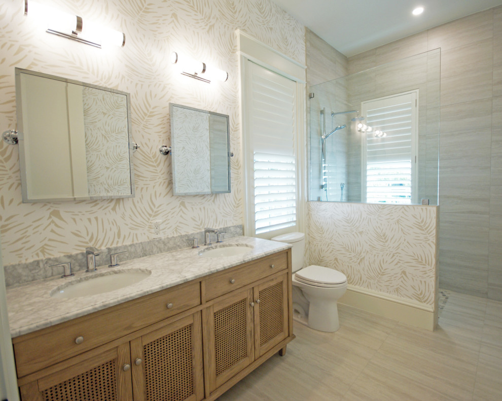Example of a mid-sized island style master multicolored tile and ceramic tile ceramic tile and gray floor bathroom design in Miami with furniture-like cabinets, gray cabinets, a one-piece toilet, multicolored walls, an undermount sink, quartzite countertops and gray countertops
