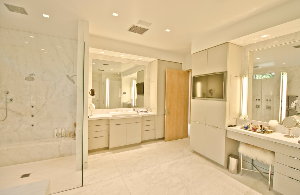 Walk-in shower - large contemporary master walk-in shower idea in Orange County with flat-panel cabinets, white cabinets, an undermount tub, white walls, an integrated sink and marble countertops
