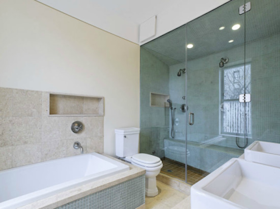 Ensuite bathroom in New York with a pedestal sink, a japanese bath, an alcove shower, a one-piece toilet, beige tiles, ceramic tiles, beige walls and ceramic flooring.