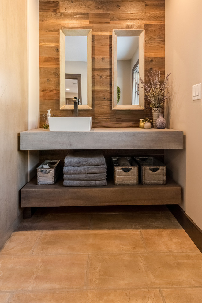 Example of a mid-sized urban master bathroom design in Other with a vessel sink and concrete countertops