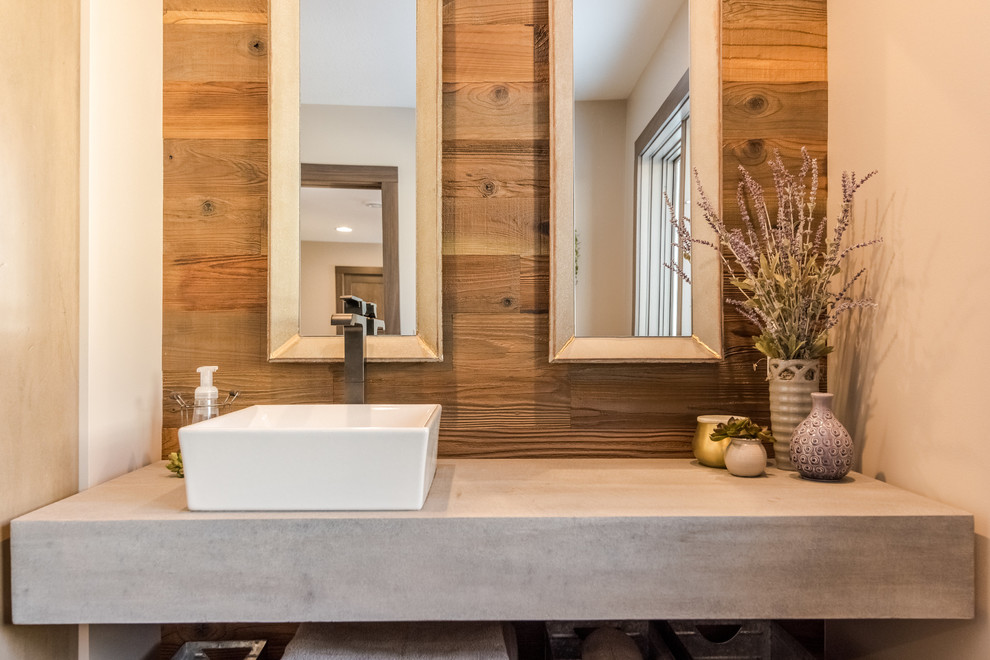Inspiration for a mid-sized industrial master bathroom remodel in Other with a vessel sink and concrete countertops