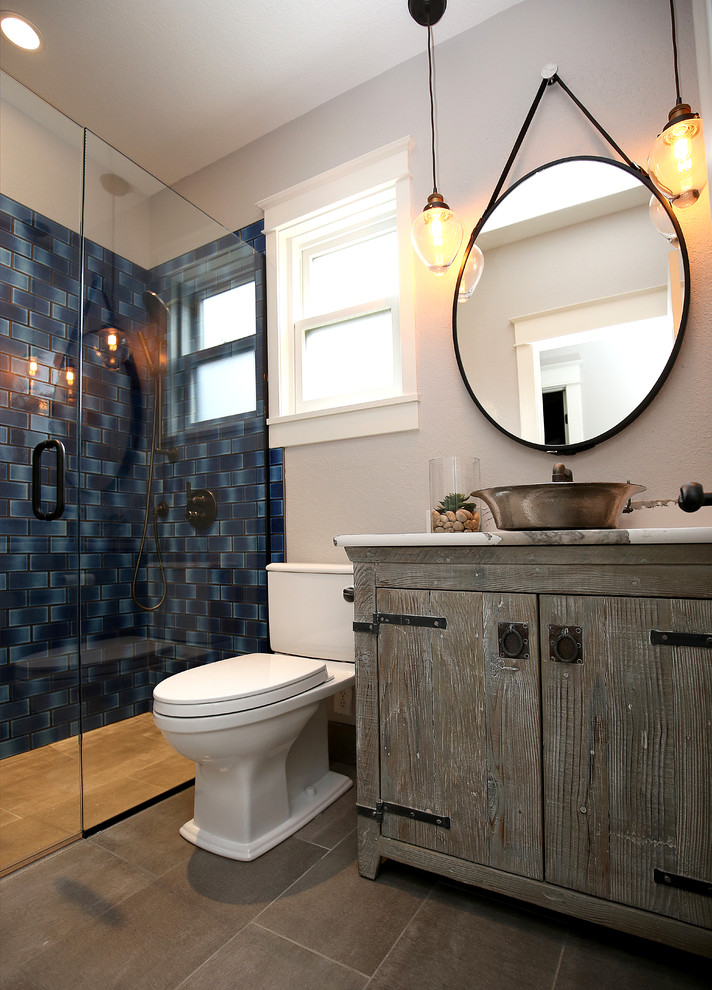 Inspiration for a small eclectic 3/4 blue tile porcelain tile and gray floor walk-in shower remodel in Denver with furniture-like cabinets, gray cabinets, a vessel sink, quartz countertops, a hinged shower door, multicolored countertops and gray walls