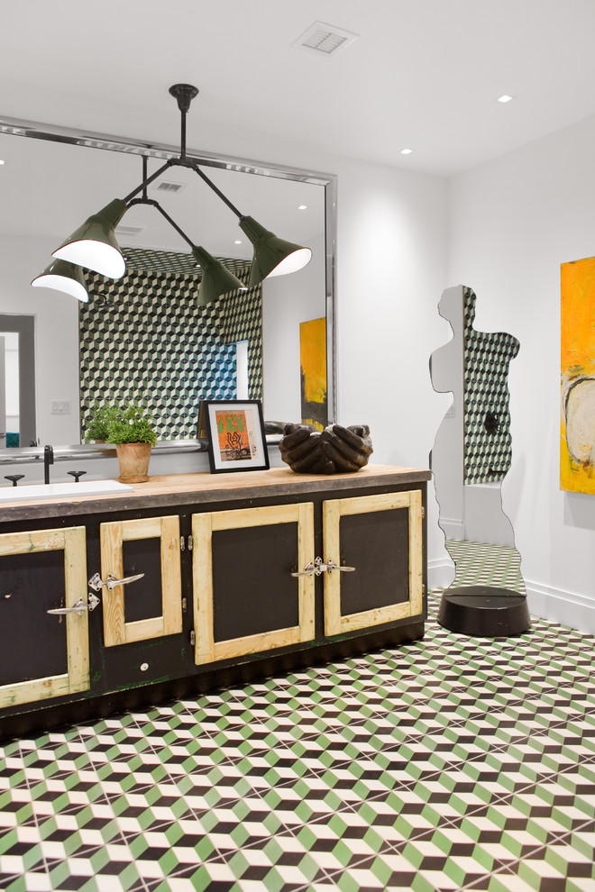 Example of a mid-sized urban green tile and cement tile ceramic tile and multicolored floor bathroom design in Other with furniture-like cabinets, distressed cabinets, white walls, a drop-in sink, a one-piece toilet, concrete countertops and beige countertops