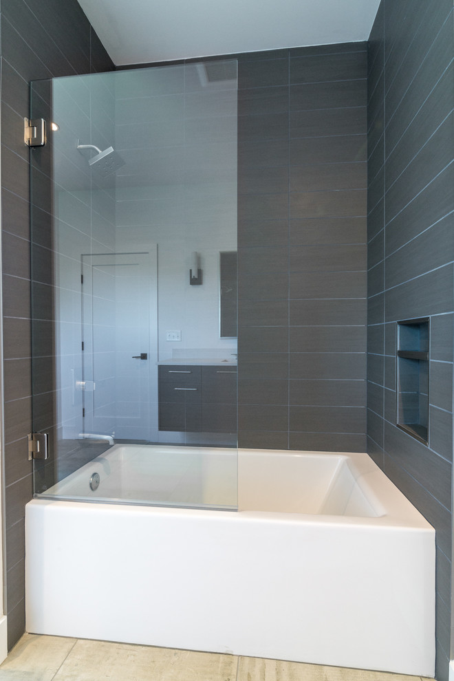 Example of a trendy gray tile and porcelain tile porcelain tile and gray floor bathroom design in Other with white walls and a hinged shower door