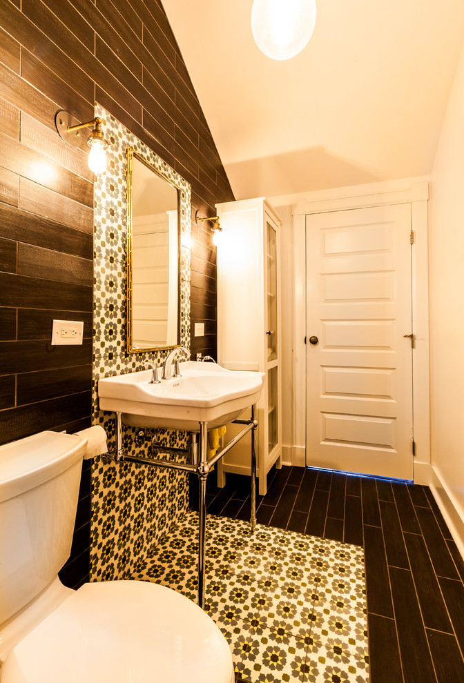 Medium sized industrial bathroom in Chicago with a console sink, an alcove bath, a two-piece toilet, black tiles, ceramic tiles, white walls and ceramic flooring.