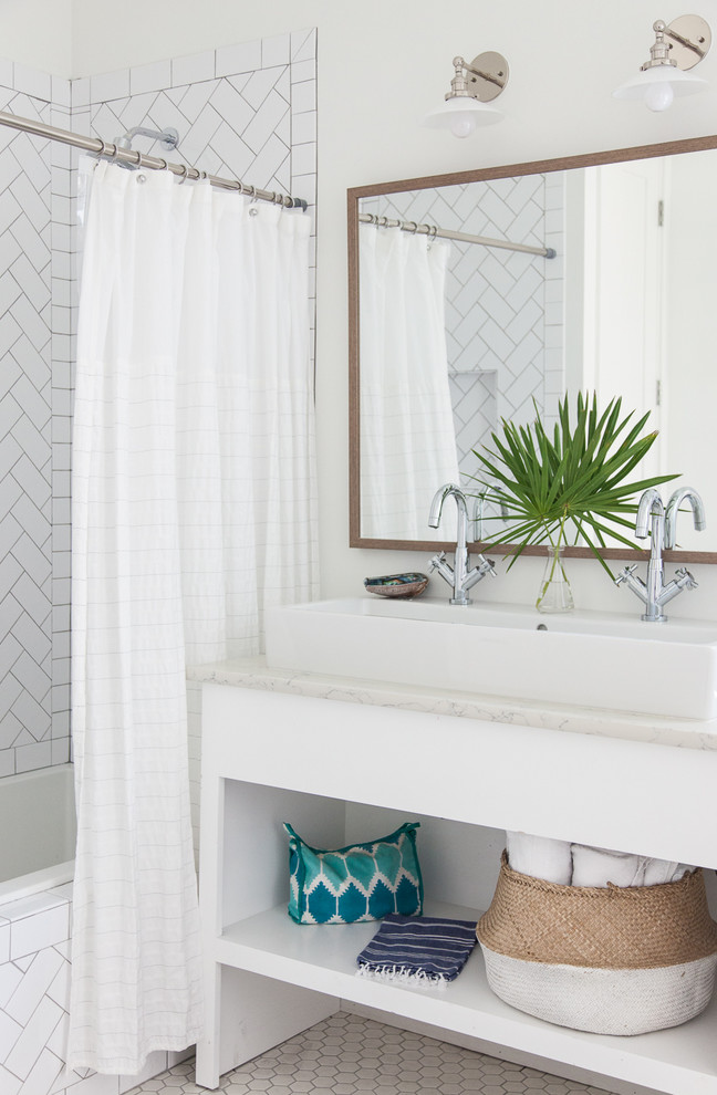 Bathroom - coastal white tile bathroom idea in Miami with open cabinets, white cabinets, white walls and a trough sink