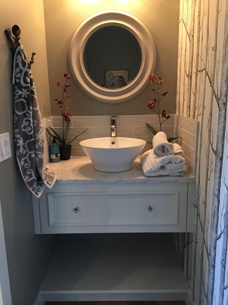 Inspiration for a mid-sized timeless 3/4 beige tile, gray tile and porcelain tile bathroom remodel in Calgary with recessed-panel cabinets, white cabinets, a one-piece toilet, gray walls, a vessel sink and quartz countertops