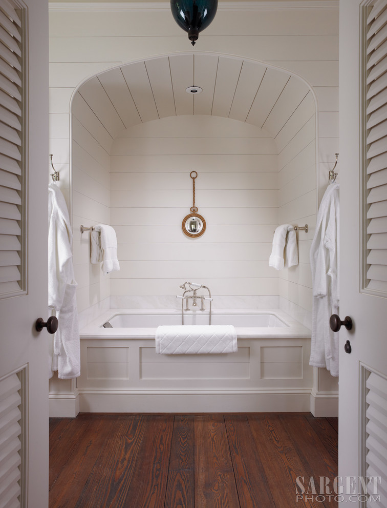 Alcove bathtub - mid-sized mediterranean master white tile dark wood floor and brown floor alcove bathtub idea in Denver with white cabinets, white walls and an undermount sink