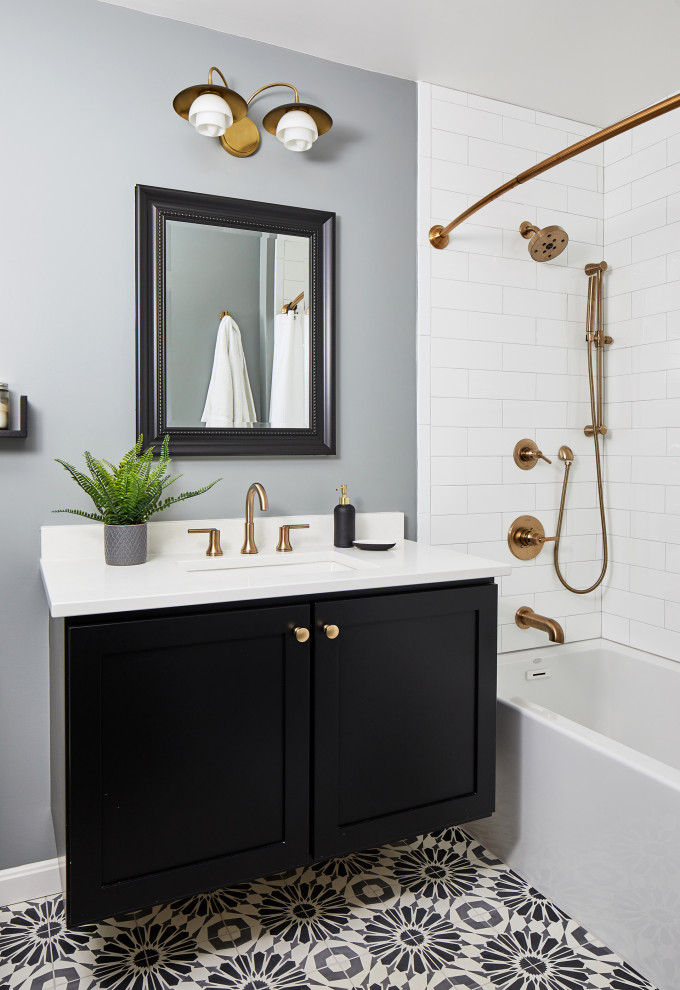 Design ideas for a large classic bathroom in DC Metro with blue cabinets and dark hardwood flooring.