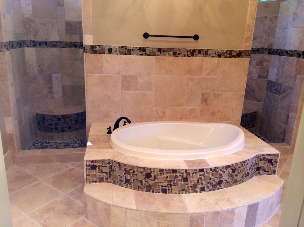 Large mediterranean ensuite bathroom in Austin with a built-in bath, a walk-in shower, mosaic tiles, white walls, raised-panel cabinets, dark wood cabinets and travertine flooring.