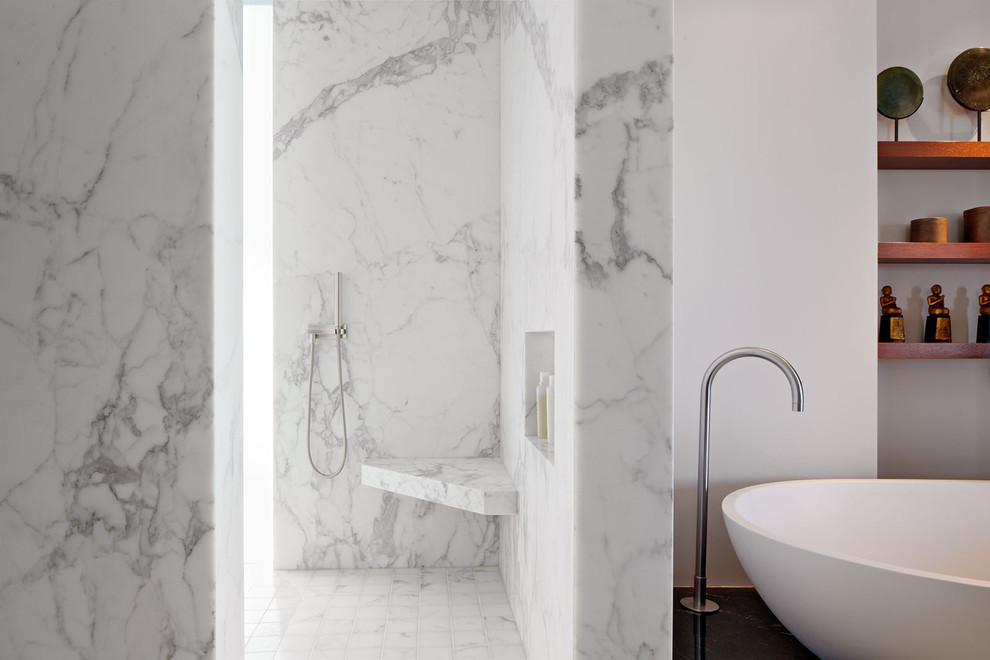 Shower bench - modern marble tile shower bench idea in San Francisco with a niche
