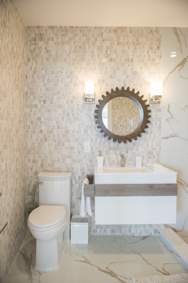 Design ideas for a medium sized contemporary shower room bathroom in New York with flat-panel cabinets, white cabinets, a two-piece toilet, beige tiles, mosaic tiles, beige walls, marble flooring, a wall-mounted sink and a walk-in shower.