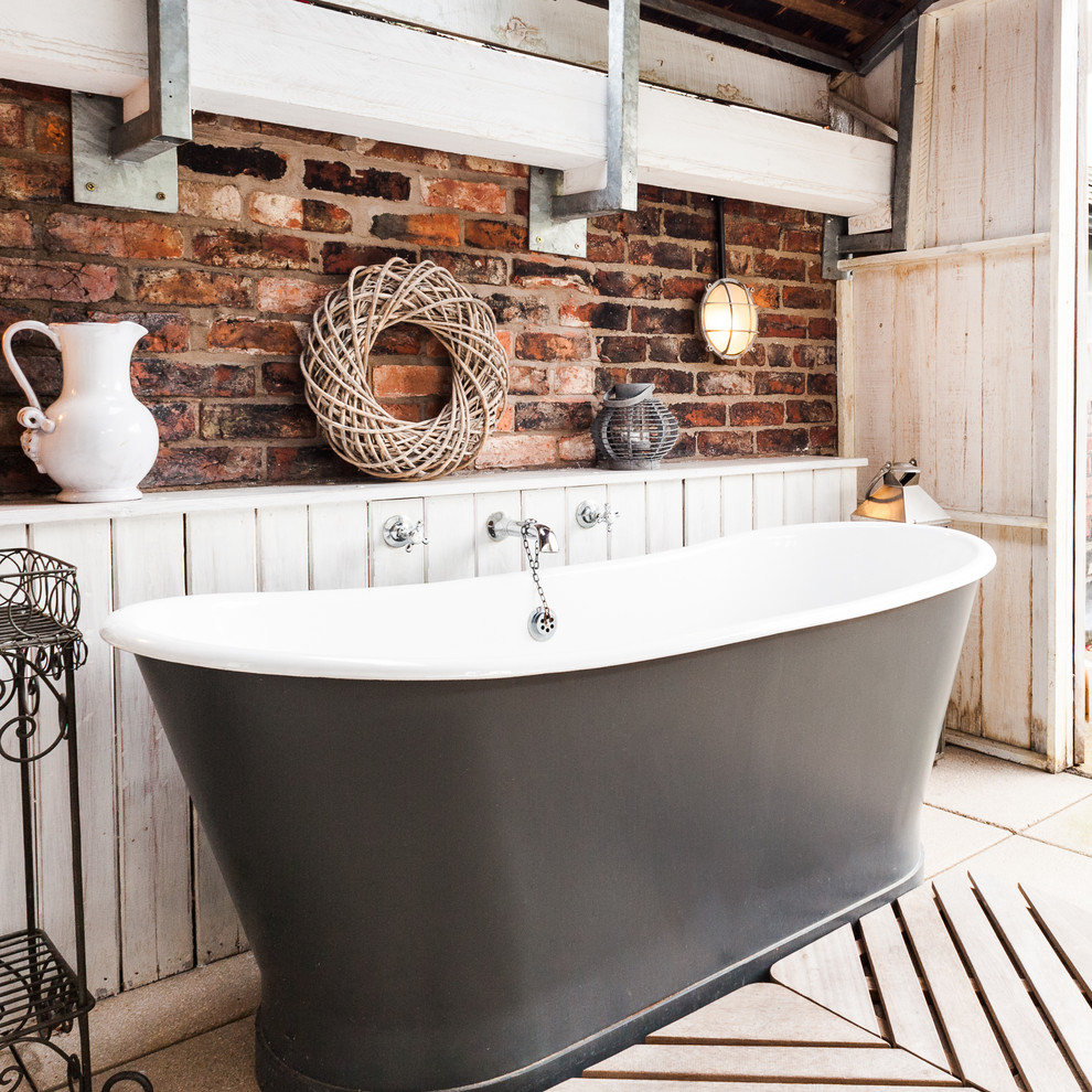 Inspiration for a shabby-chic style freestanding bathtub remodel in Manchester with multicolored walls