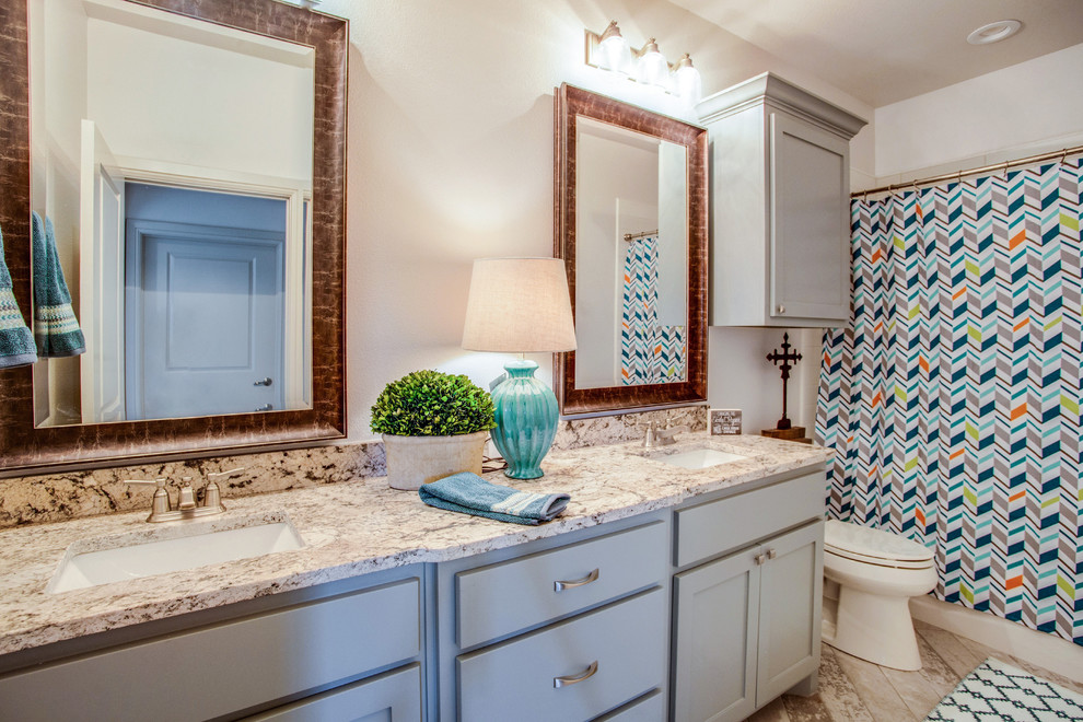Example of a classic bathroom design in Austin with shaker cabinets, gray cabinets, white walls and an undermount sink