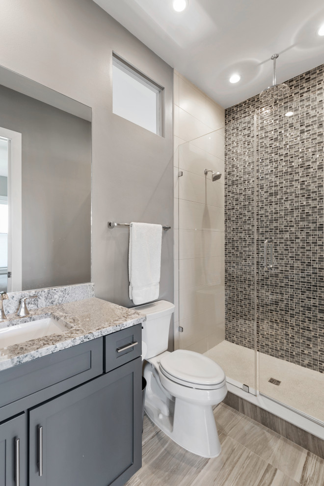 Contemporary family bathroom in Orlando with shaker cabinets, grey cabinets, an alcove shower, beige tiles, ceramic tiles, grey walls, a built-in sink, engineered stone worktops, a hinged door, beige worktops, a single sink and a built in vanity unit.