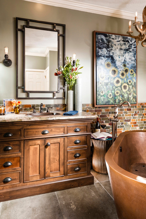 Example of a large transitional master multicolored tile and stone tile porcelain tile freestanding bathtub design in Other with a drop-in sink, recessed-panel cabinets, medium tone wood cabinets, granite countertops and gray walls