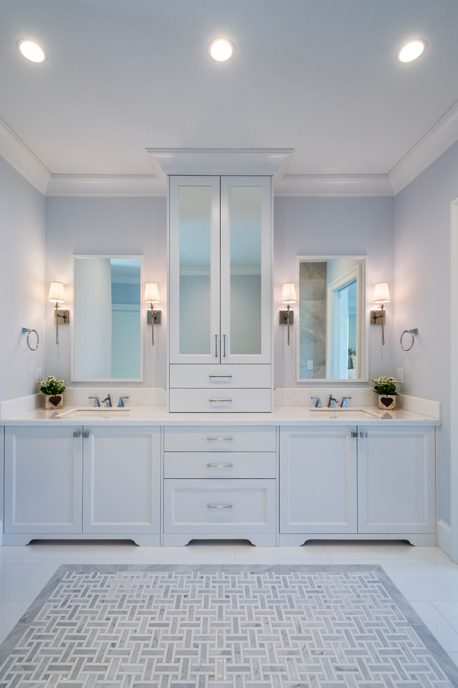 Example of a large farmhouse master porcelain tile and white floor bathroom design in Vancouver with flat-panel cabinets, white cabinets, gray walls, an undermount sink, quartz countertops, a hinged shower door and white countertops