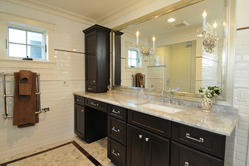 Design ideas for a large classic bathroom in Chicago with a submerged sink, recessed-panel cabinets, marble worktops, a freestanding bath, an alcove shower, white tiles, metro tiles, white walls, marble flooring and dark wood cabinets.