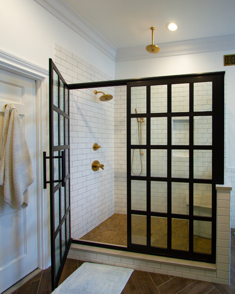 Example of a huge eclectic master multicolored tile and cement tile porcelain tile and brown floor double shower design in Philadelphia with recessed-panel cabinets, white cabinets, a two-piece toilet, white walls, an undermount sink, quartzite countertops, a hinged shower door and beige countertops