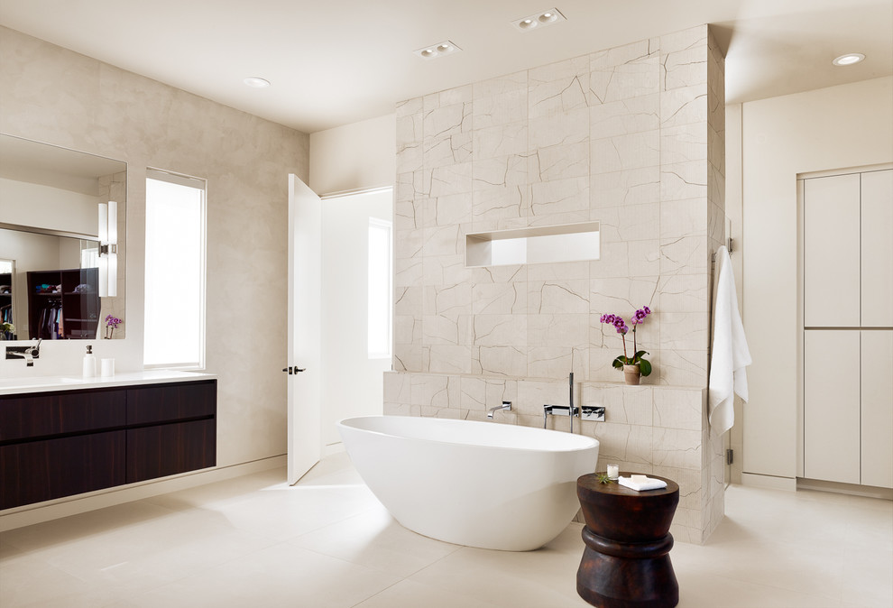 Design ideas for a large contemporary bathroom in Austin with flat-panel cabinets, dark wood cabinets, a freestanding bath, a walk-in shower, beige tiles, porcelain tiles, beige walls, porcelain flooring, a submerged sink, engineered stone worktops and an open shower.