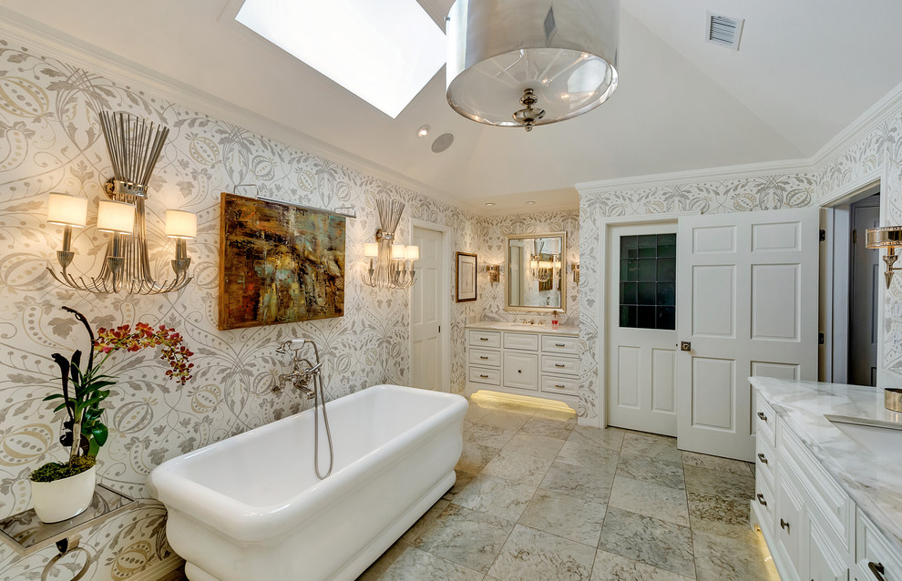 Large traditional ensuite bathroom in Dallas with raised-panel cabinets, white cabinets, a freestanding bath, multi-coloured walls and marble worktops.