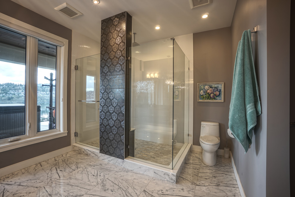 This is an example of a large contemporary ensuite bathroom in Vancouver with flat-panel cabinets, grey cabinets, a double shower, a one-piece toilet, grey tiles, grey walls, marble flooring, a built-in sink, engineered stone worktops, grey floors, a hinged door and grey worktops.