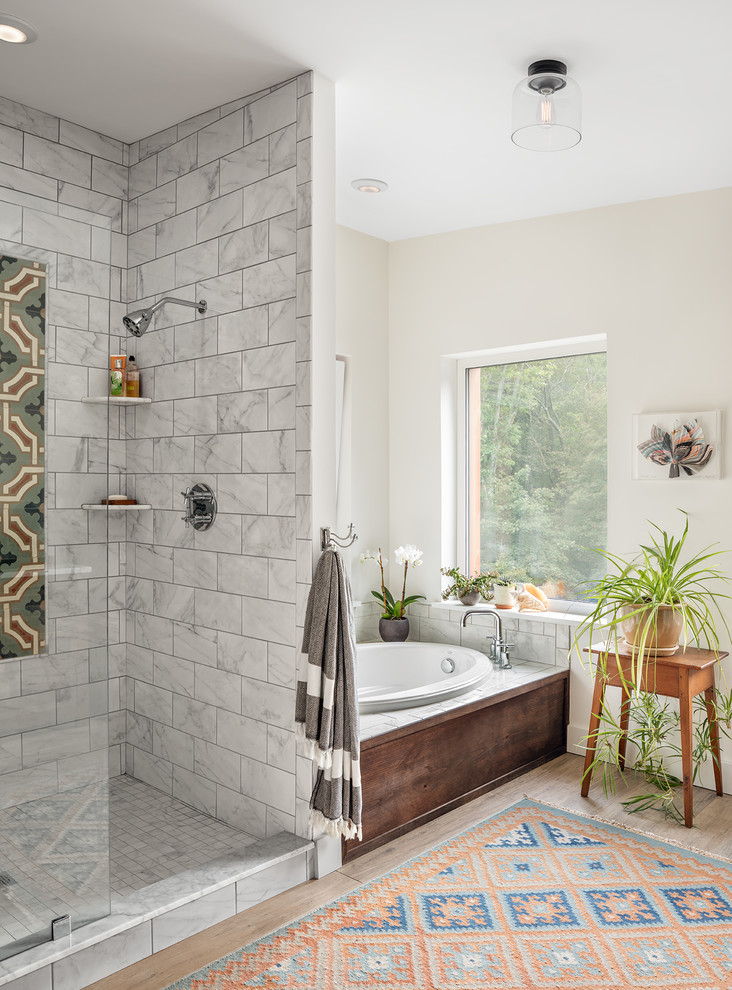 Traditional ensuite bathroom in Portland Maine with a walk-in shower, white walls, a built-in bath, grey tiles and an open shower.