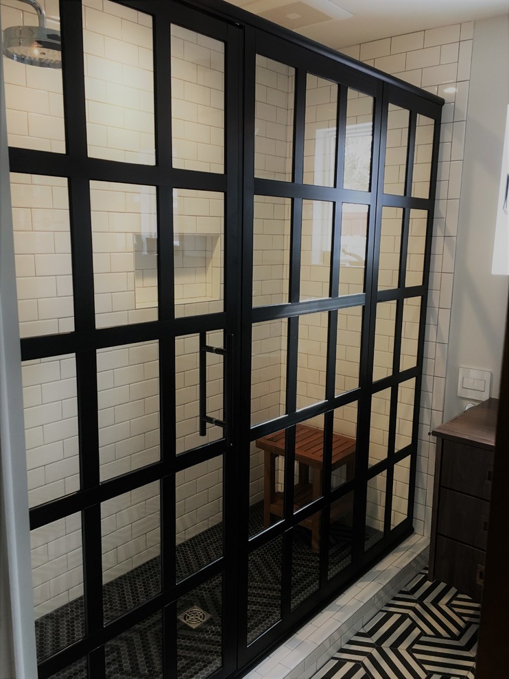 Example of a mid-sized 1950s master white tile and subway tile multicolored floor alcove shower design in Other with flat-panel cabinets, dark wood cabinets, white walls, a vessel sink, wood countertops, a hinged shower door and brown countertops