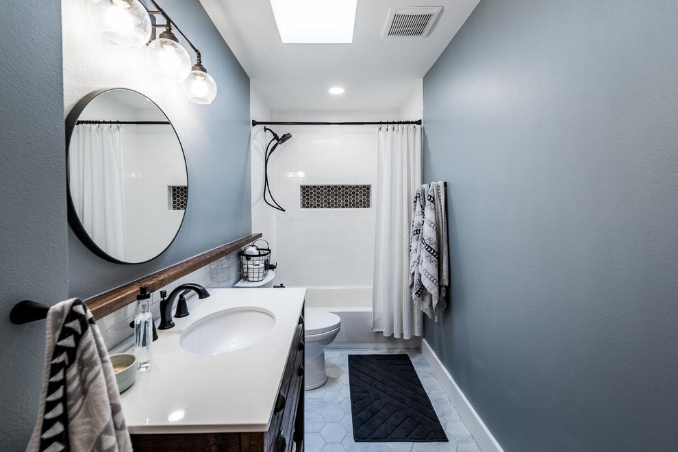 Bathroom - mid-sized cottage kids' white tile and ceramic tile ceramic tile and gray floor bathroom idea in Dallas with open cabinets, distressed cabinets, a one-piece toilet, blue walls, an undermount sink, quartz countertops and white countertops