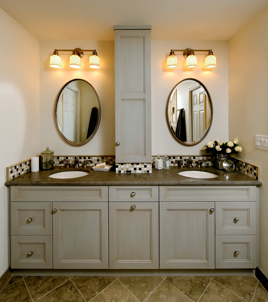Bathroom - mid-sized traditional kids' gray tile and stone tile travertine floor bathroom idea in DC Metro with an undermount sink, recessed-panel cabinets, gray cabinets, granite countertops, a one-piece toilet and beige walls