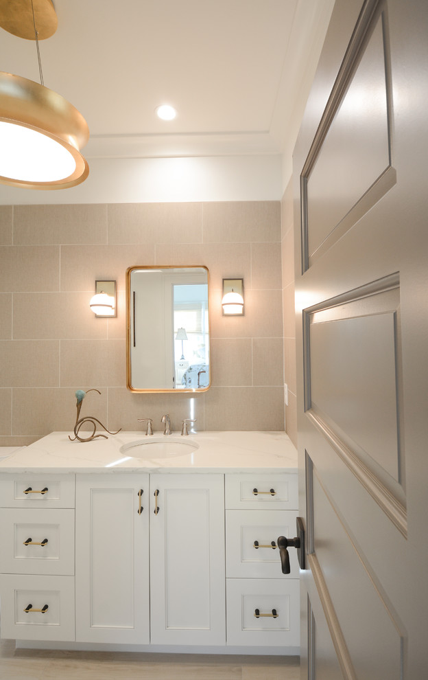 Photo of a medium sized rural shower room bathroom in Charleston with recessed-panel cabinets, white cabinets, brown tiles, porcelain tiles, light hardwood flooring, a submerged sink, marble worktops, brown floors and white worktops.