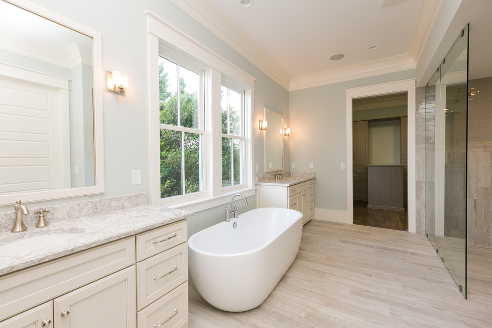 Bathroom - large coastal black tile and porcelain tile porcelain tile bathroom idea in Charleston with shaker cabinets, beige cabinets, a two-piece toilet, blue walls, an undermount sink and quartz countertops
