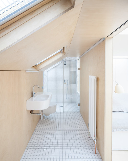 Attic Bathrooms with Sloped Ceilings and Wood Textures
