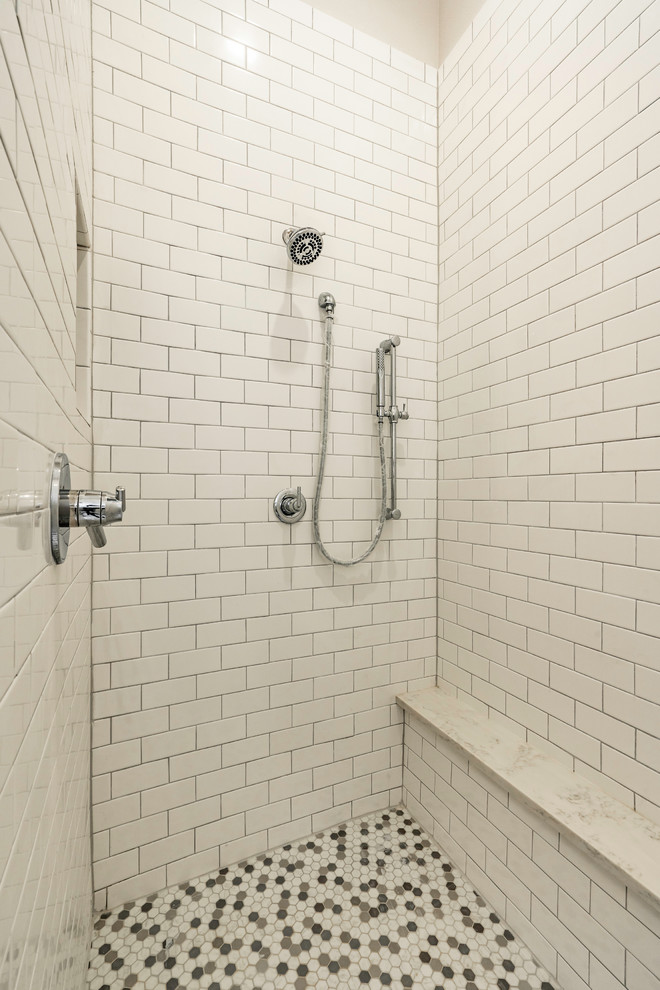 Large farmhouse master white tile and subway tile concrete floor and gray floor alcove shower photo in Austin with white cabinets, a two-piece toilet, beige walls, an undermount sink, marble countertops, a hinged shower door, white countertops and shaker cabinets