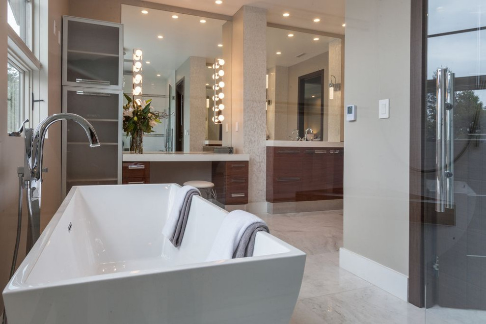 Photo of a medium sized ensuite bathroom in San Diego with freestanding cabinets, dark wood cabinets, a freestanding bath, an alcove shower, a one-piece toilet, beige tiles, ceramic tiles, beige walls, ceramic flooring, a submerged sink, granite worktops, beige floors, a hinged door, beige worktops, double sinks, a freestanding vanity unit, a coffered ceiling and panelled walls.