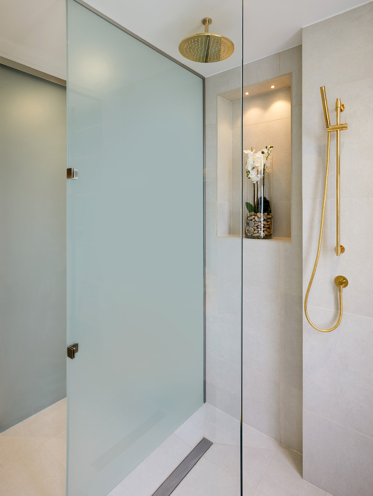 This is an example of a medium sized contemporary wet room bathroom in London with an open shower.