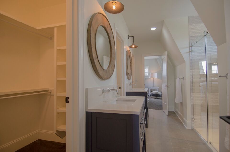 Inspiration for a large transitional master white tile and stone slab slate floor and beige floor alcove shower remodel in Columbus with shaker cabinets, dark wood cabinets, an undermount tub, a two-piece toilet, white walls, an undermount sink, quartzite countertops and a hinged shower door